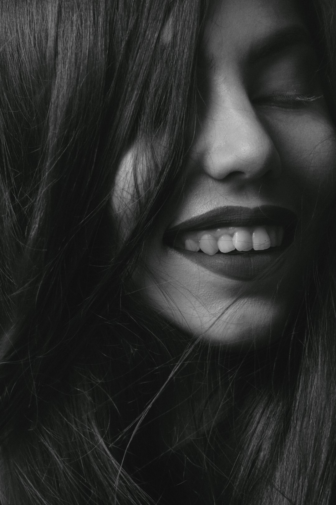 Portrait of a smiling woman with long hair